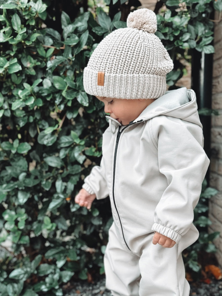 Regenoverall aus Sand