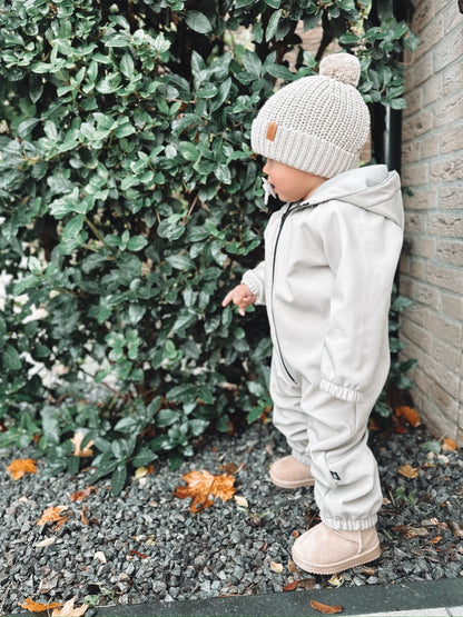 Knitted pompom mutsje (sand)